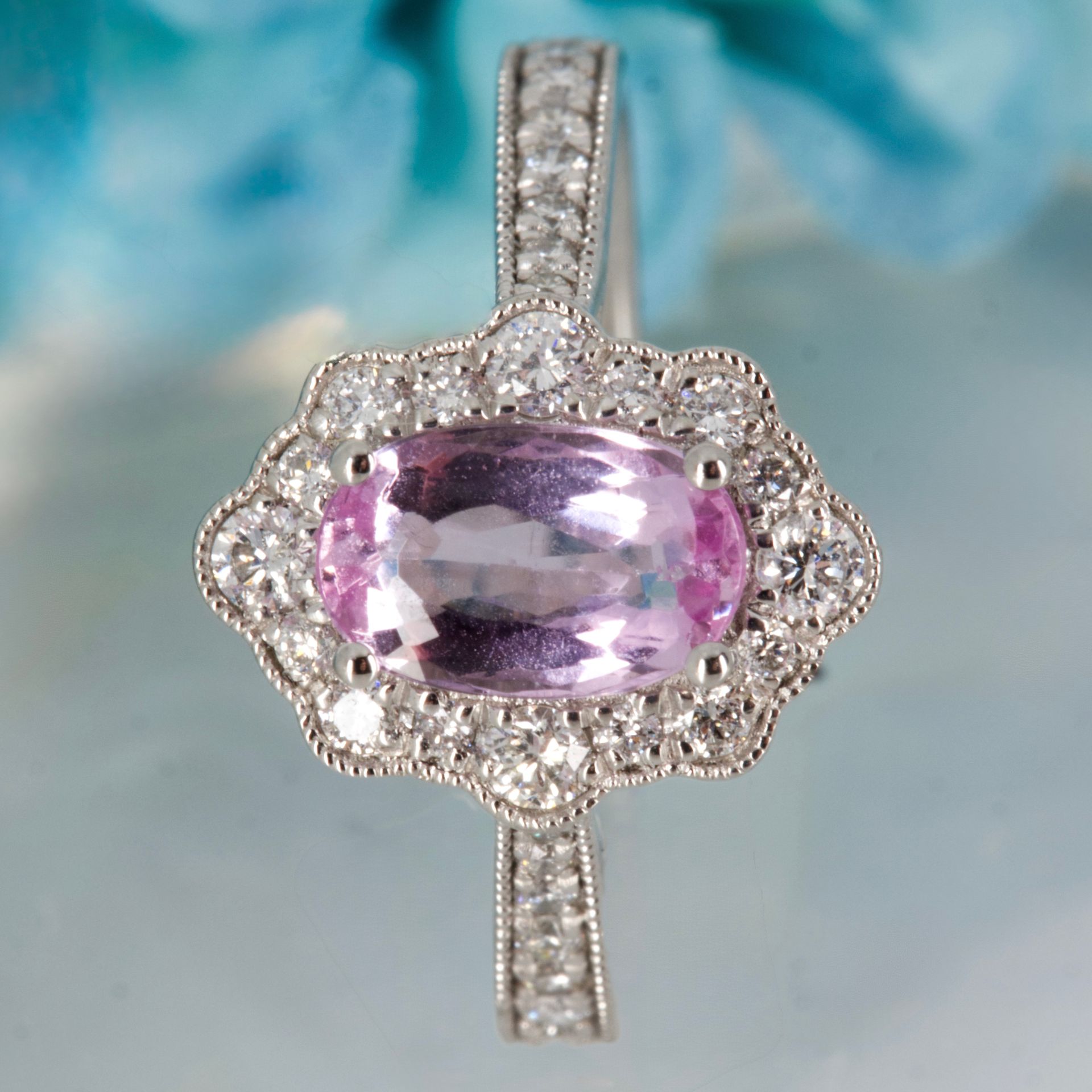 Platinum Oval Cut Pink Topaz & Round Brilliant Cut Diamond Cluster Ring