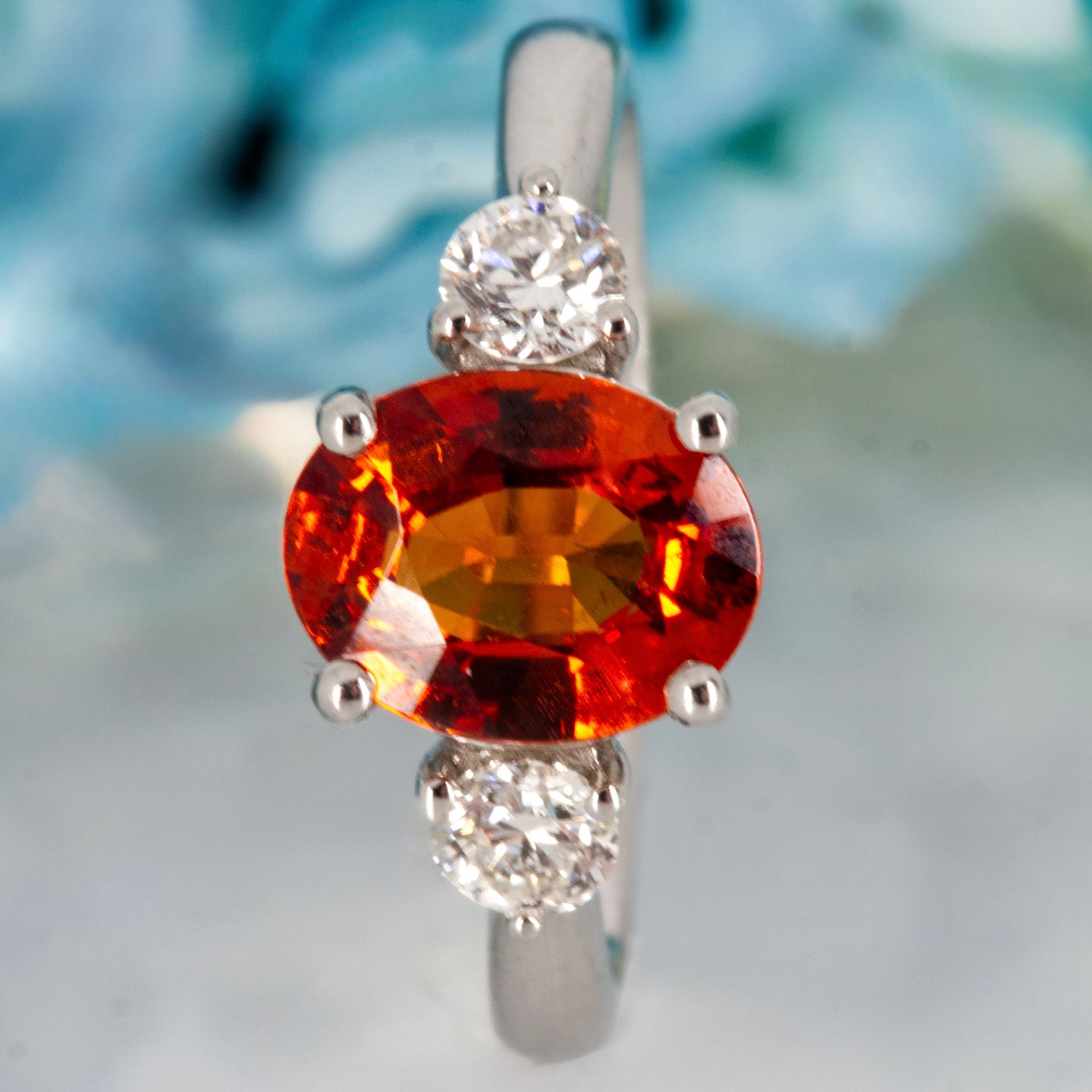 Platinum Oval Cut Mandarin Garnet & Round Brilliant Cut Diamond Trilogy Ring