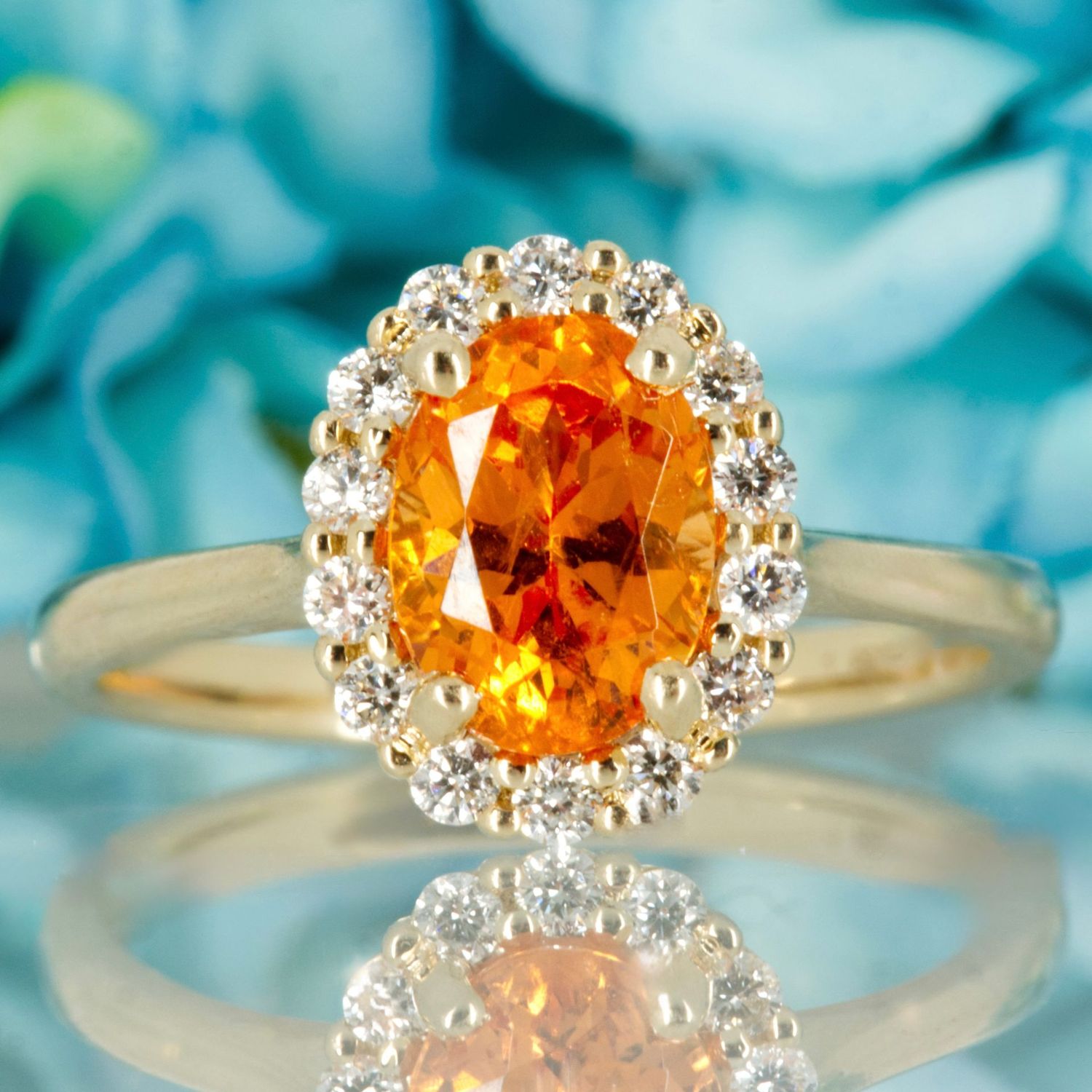 9ct Yellow Gold Oval Cut Spessartite Garnet & Round Brilliant Cut Diamond Halo Cluster Ring