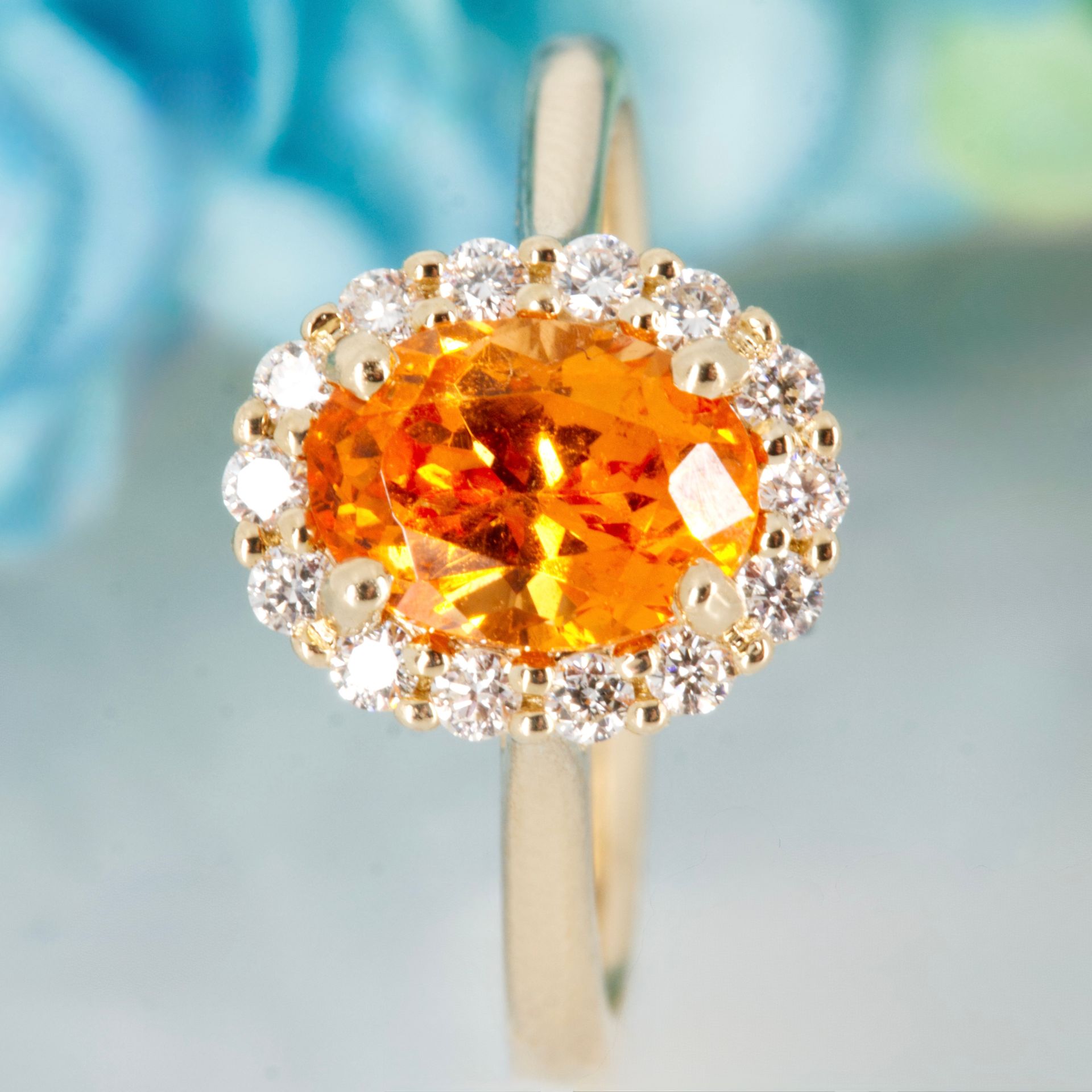 9ct Yellow Gold Oval Cut Spessartite Garnet & Round Brilliant Cut Diamond Halo Cluster Ring