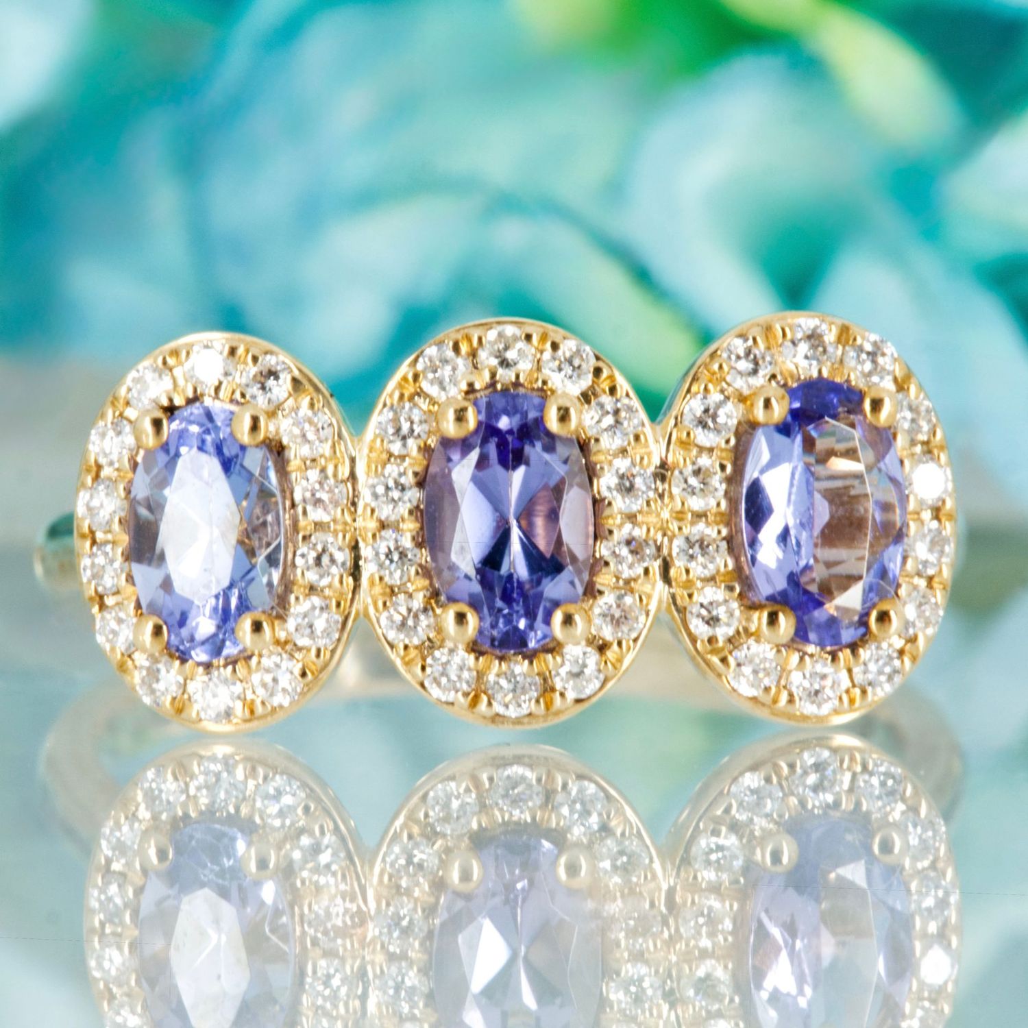 9ct Yellow Gold Oval Cut Tanzanite & Round Brilliant Cut Diamond Triple Halo Cluster Ring