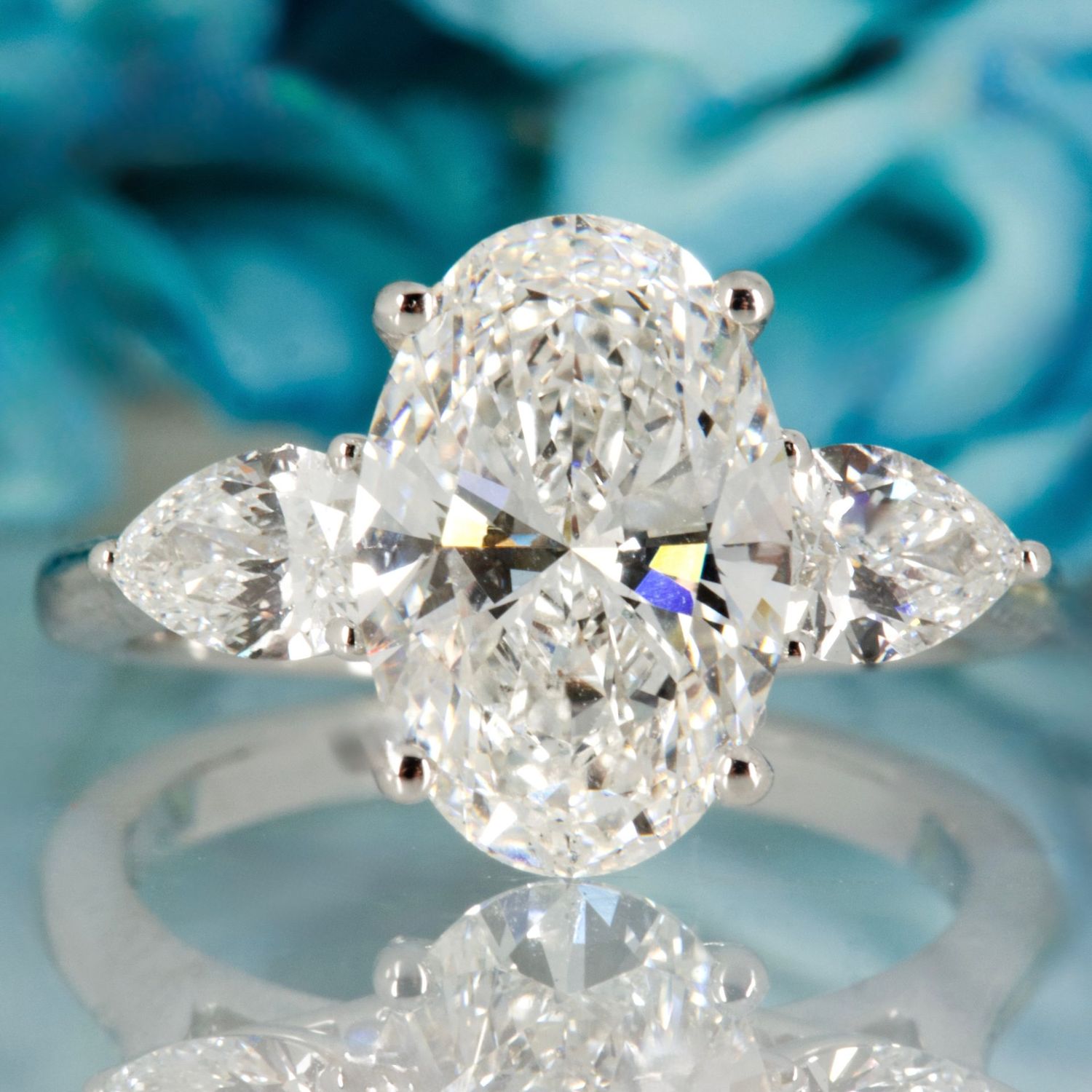 Platinum 3.69ct Oval & Pear Cut Lab Grown Diamond Trilogy Ring