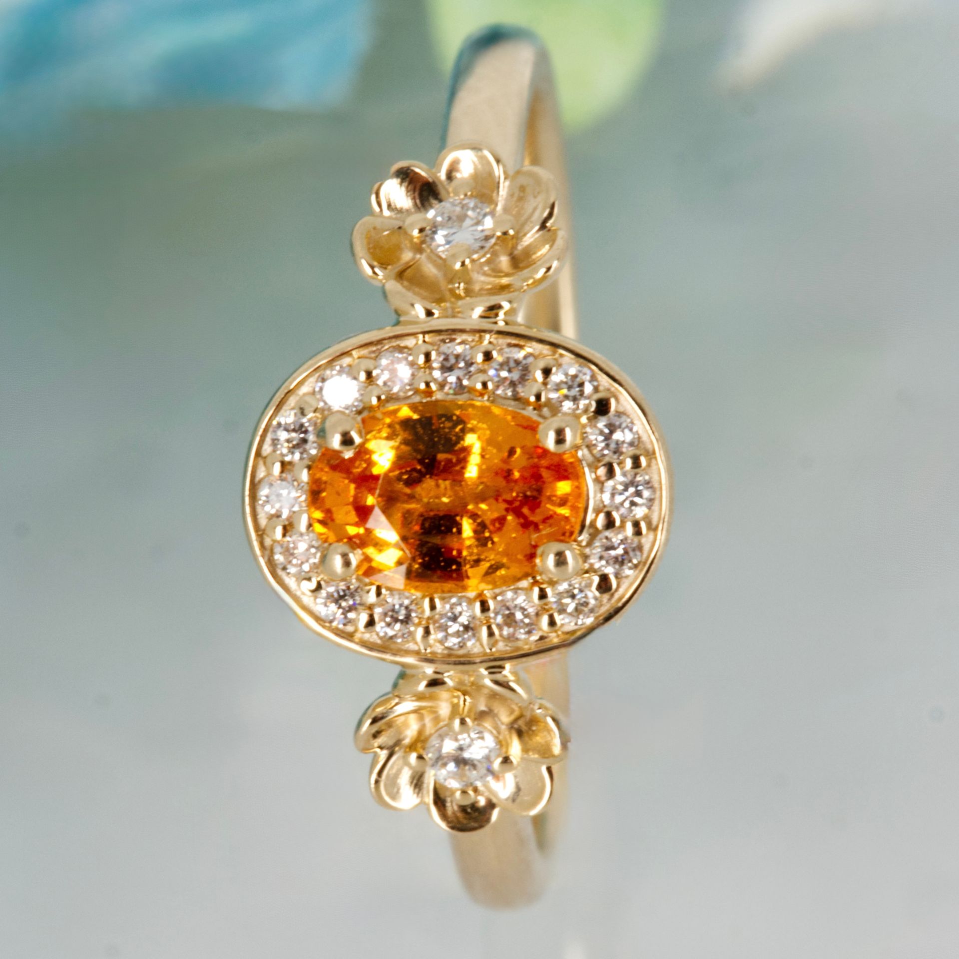 9ct Yellow Gold Oval Cut Spessartite & Round Brilliant Cut Diamond Halo Cluster Ring