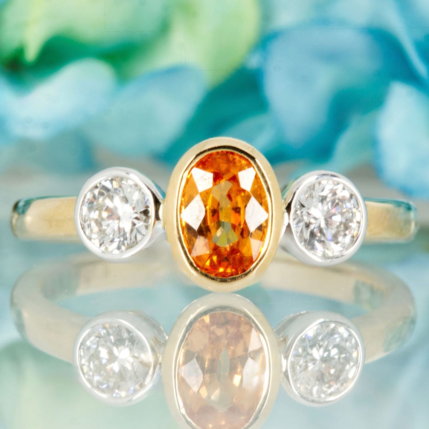 9ct Yellow Gold Oval Cut Mandarin Garnet & Round Brilliant Cut Diamond Trilogy Ring 9ct Yellow Gold Oval Cut Mandarin Garnet & Round Brilliant Cut Diamond Trilogy Ring