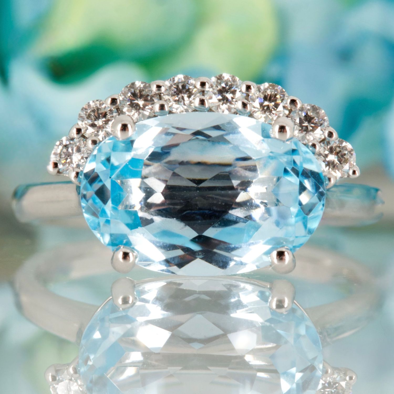 9ct White Gold Oval Cut Blue Topaz & Round Brilliant Cut Diamond Dress Ring 9ct White Gold Oval Cut Blue Topaz & Round Brilliant Cut Diamond Dress Ring