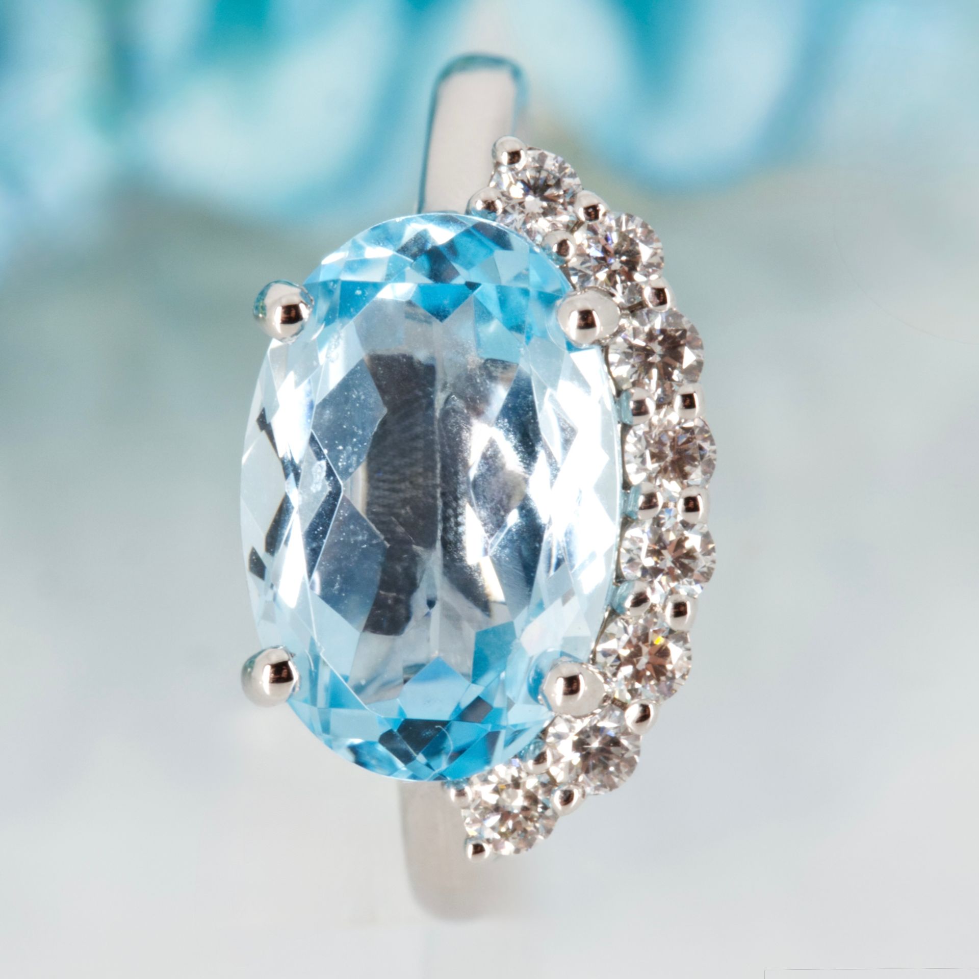 9ct White Gold Oval Cut Blue Topaz & Round Brilliant Cut Diamond Dress Ring