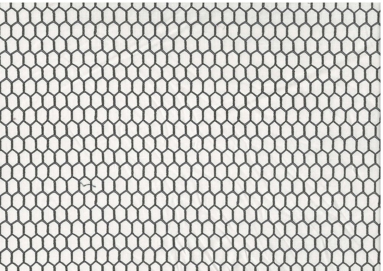 Bomullstyg med svart hönsnätsmönster på vit botten – patchworktyg.