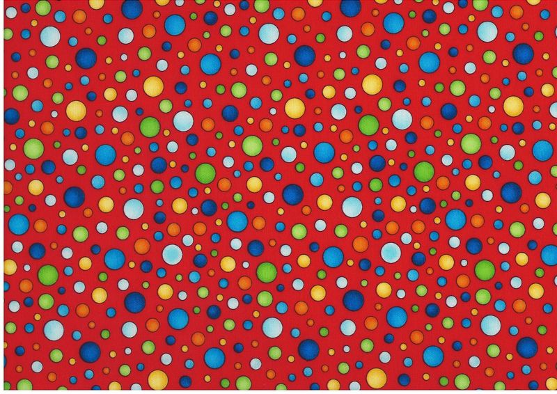 Bomullstyg med färgglada prickar på röd botten – patchworktyg.