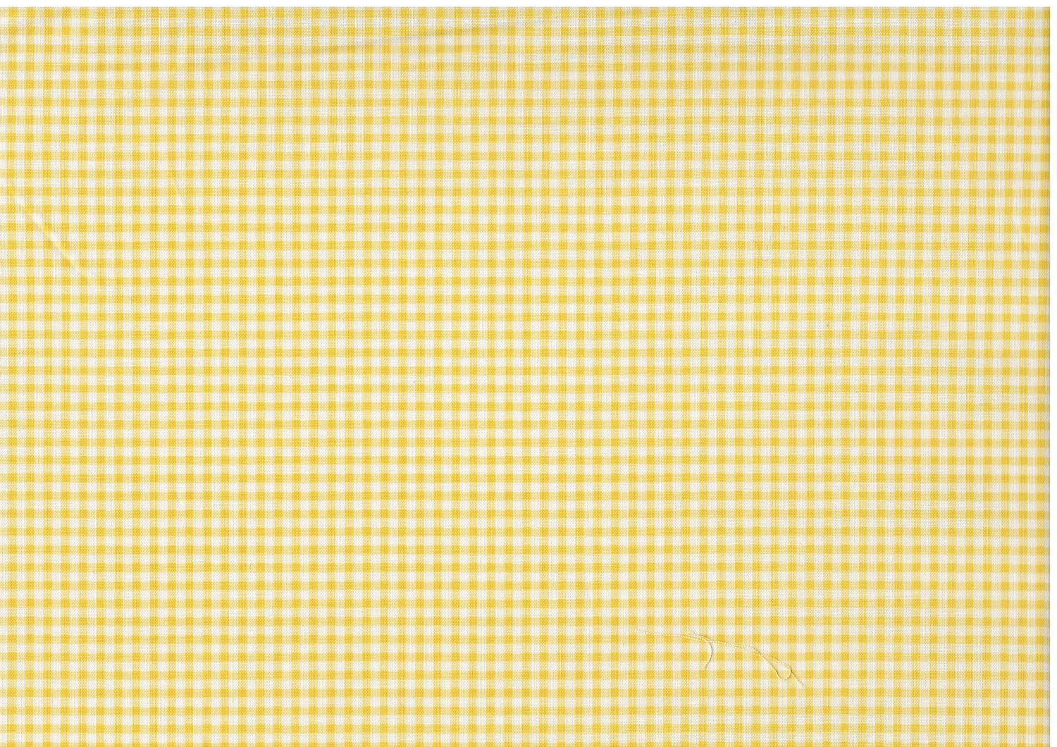 Bomullstyg med små gula rutor på vit botten – patchworktyg.
