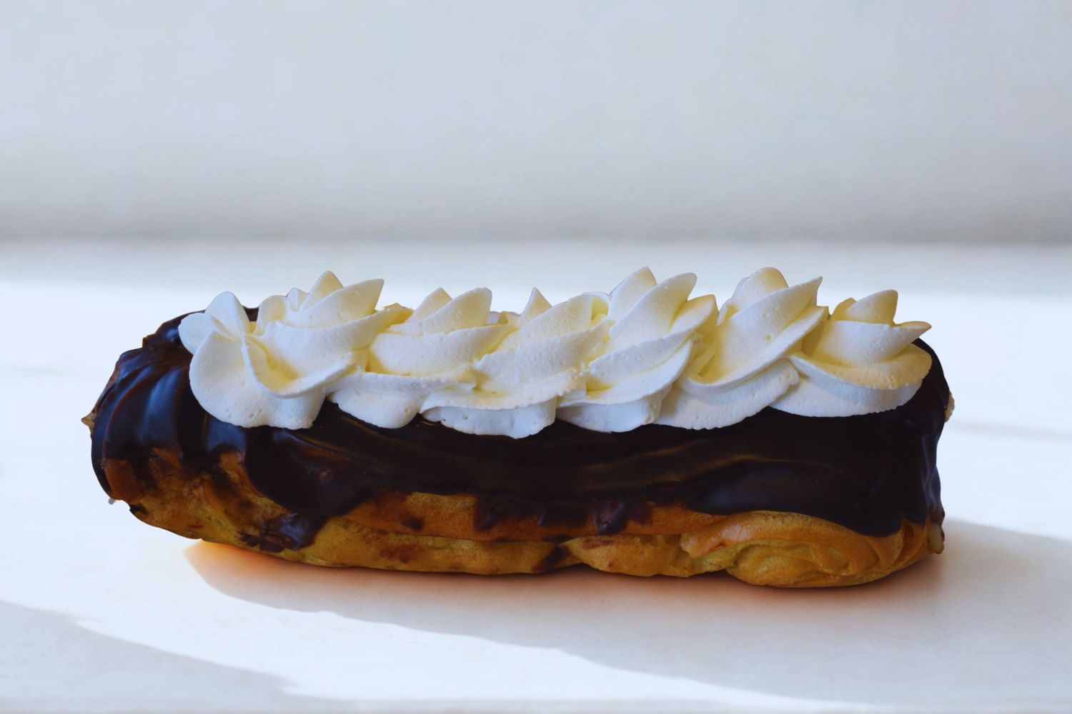 Chocolate-Covered Éclair with Pastry Cream Filling