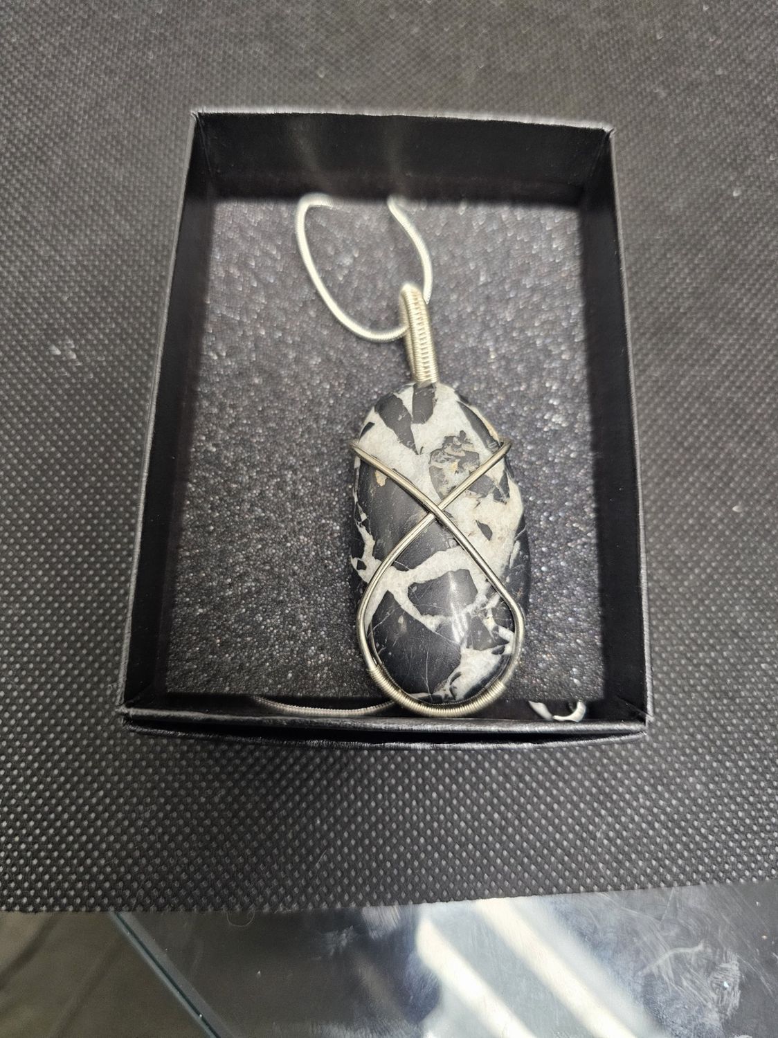 silver wrapped black septarian pendant