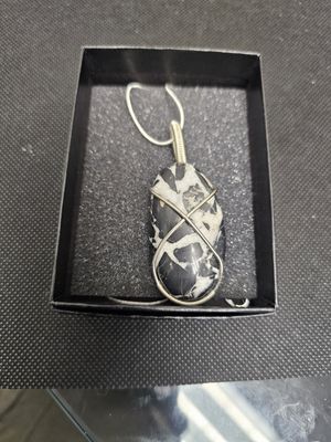 silver wrapped black septarian pendant