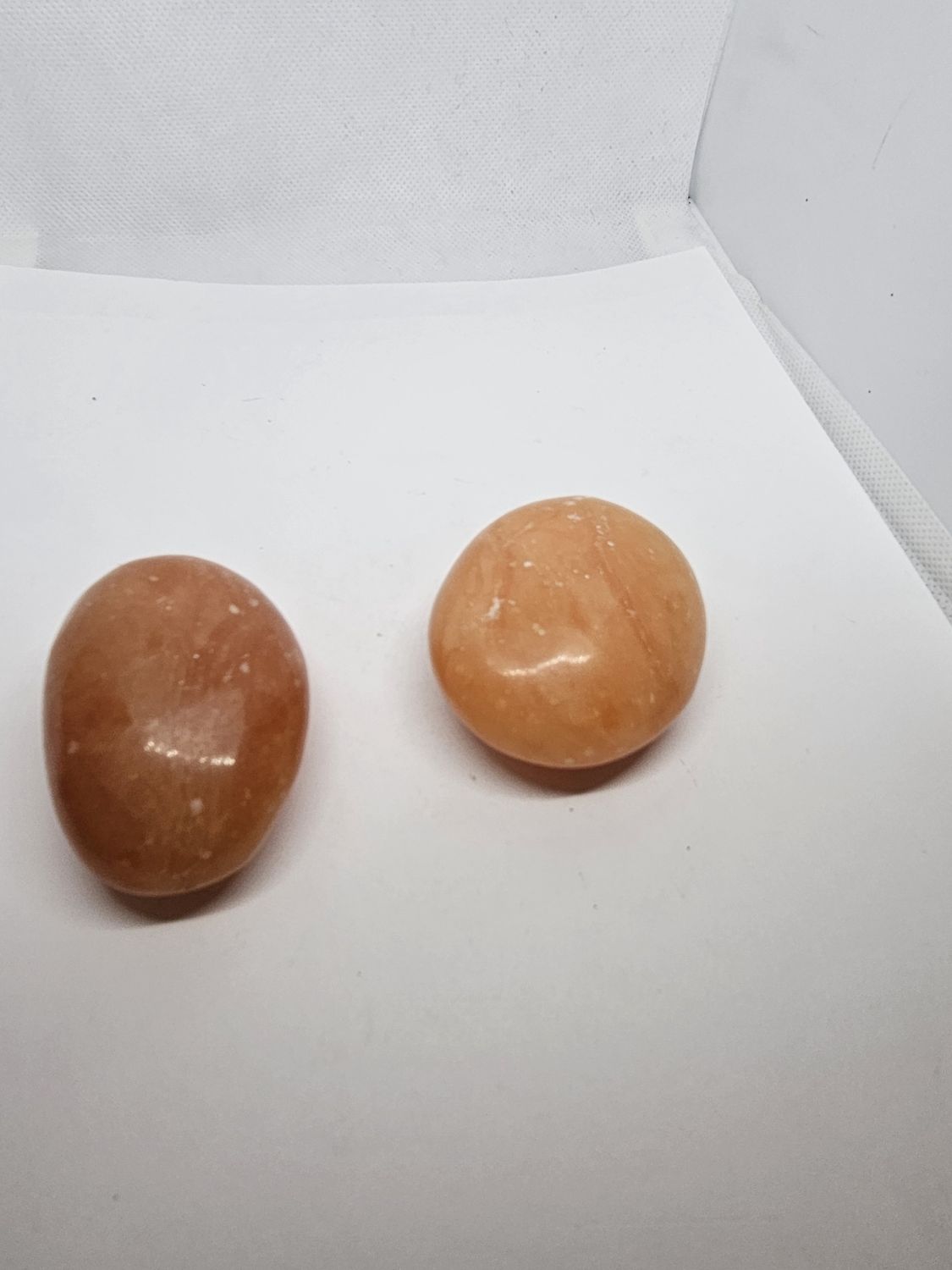 peach selenite palm stone 65mm