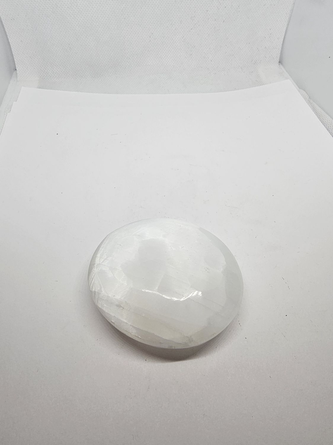 selenite faceted palm stone