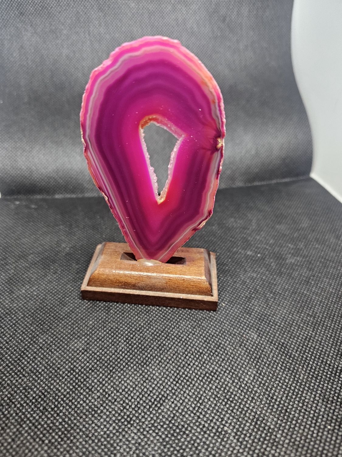 pink agate slice on stand