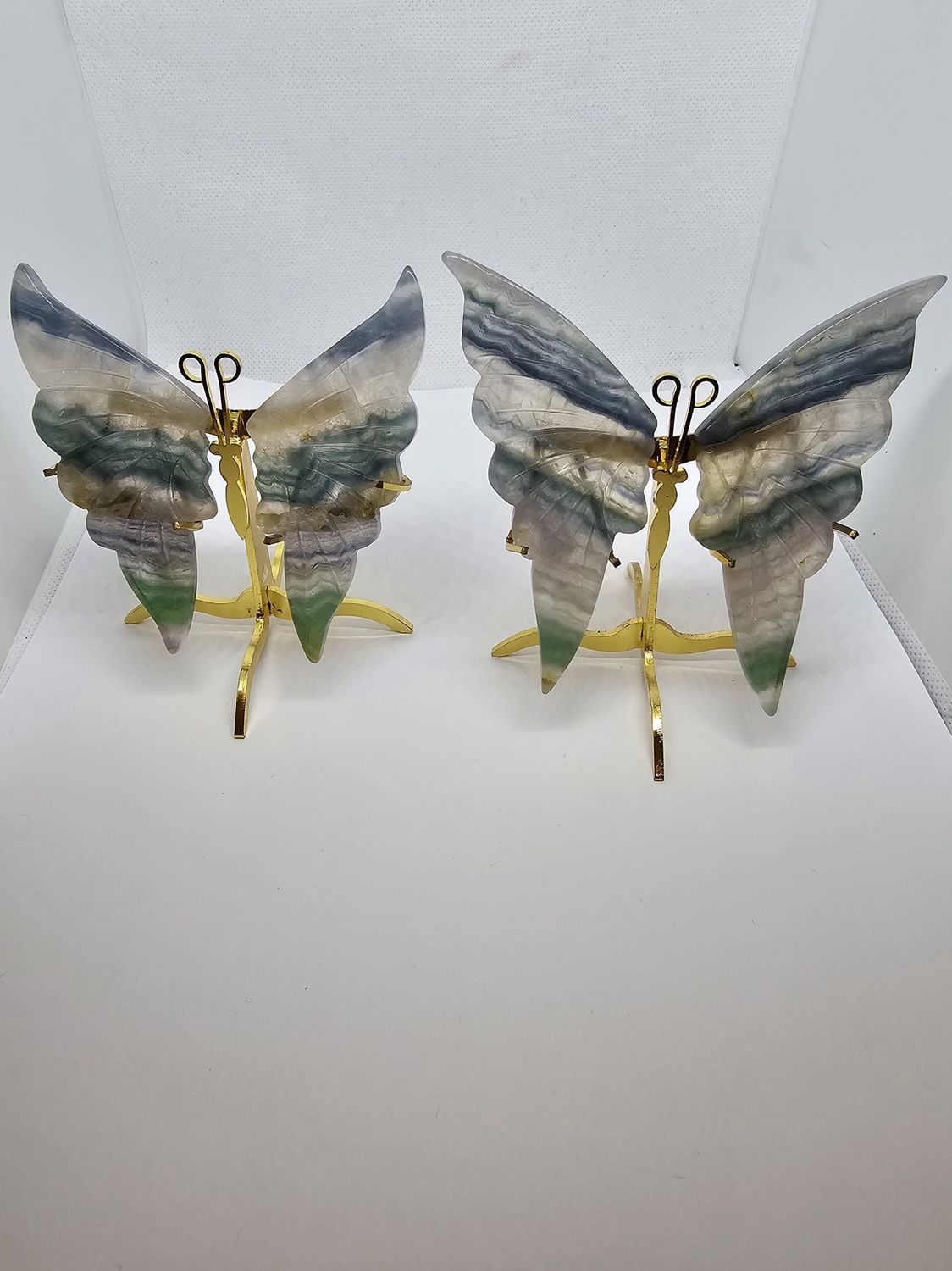 green fluorite butterflies on stands