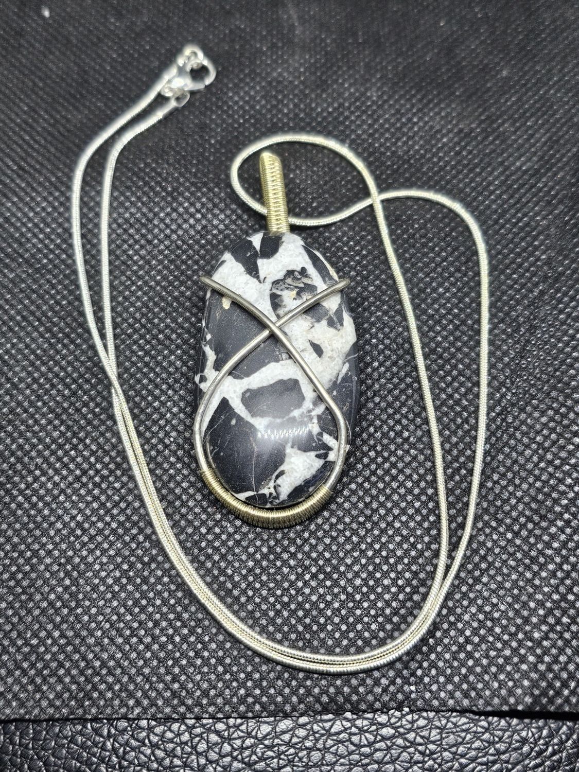 silver wrapped black septarian pendant