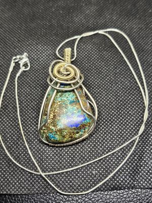 copper wire wrapped river blue pendant