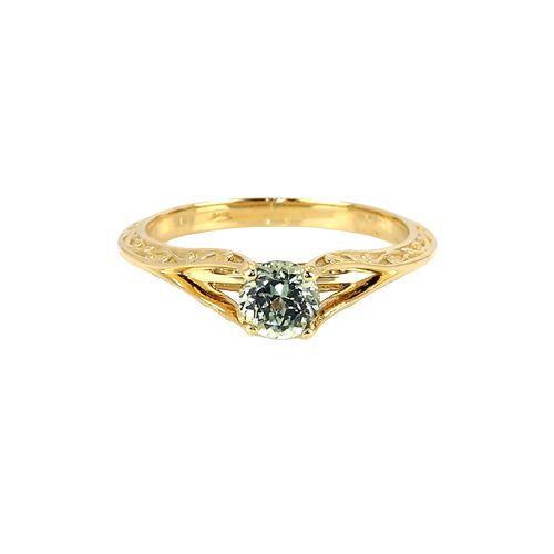 Greenish Blue Sapphire Ring - Round 0.73 Ct. - 14K Yellow Gold. Dimensions of 5.17 x 5.17 x 3.80 mm and is mixed brilliant cut. Origin is Montana