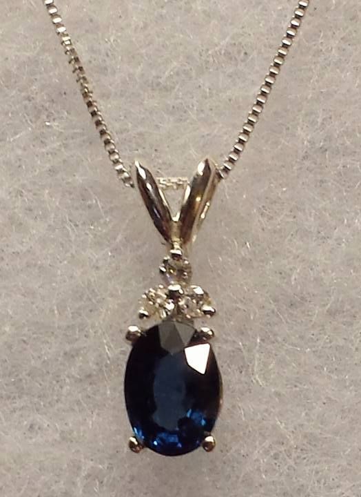 Sterling Silver 6x4 mm  oval Blue Sapphire  Pendant with diamond accents