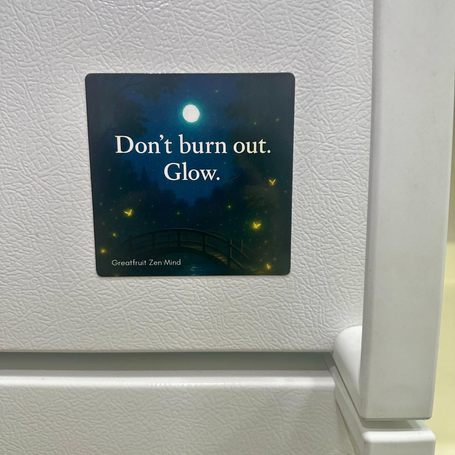 Large Magnet—Don't Burn Out. Glow. Large 'Don't burn out, glow' magnet featuring a moonlit bridge and glowing fairies stuck next to refrigerator handle.