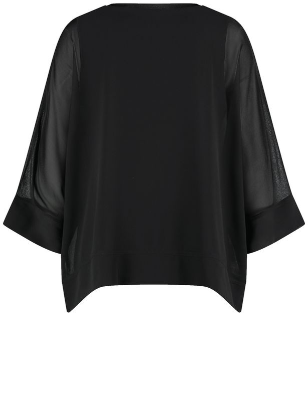 Woman In Gold Black Blouse