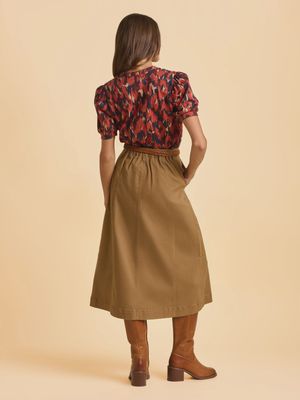 Joni Skirt Beige - midi length and elasticated back create a flattering silhouette while the straight, sharp lines