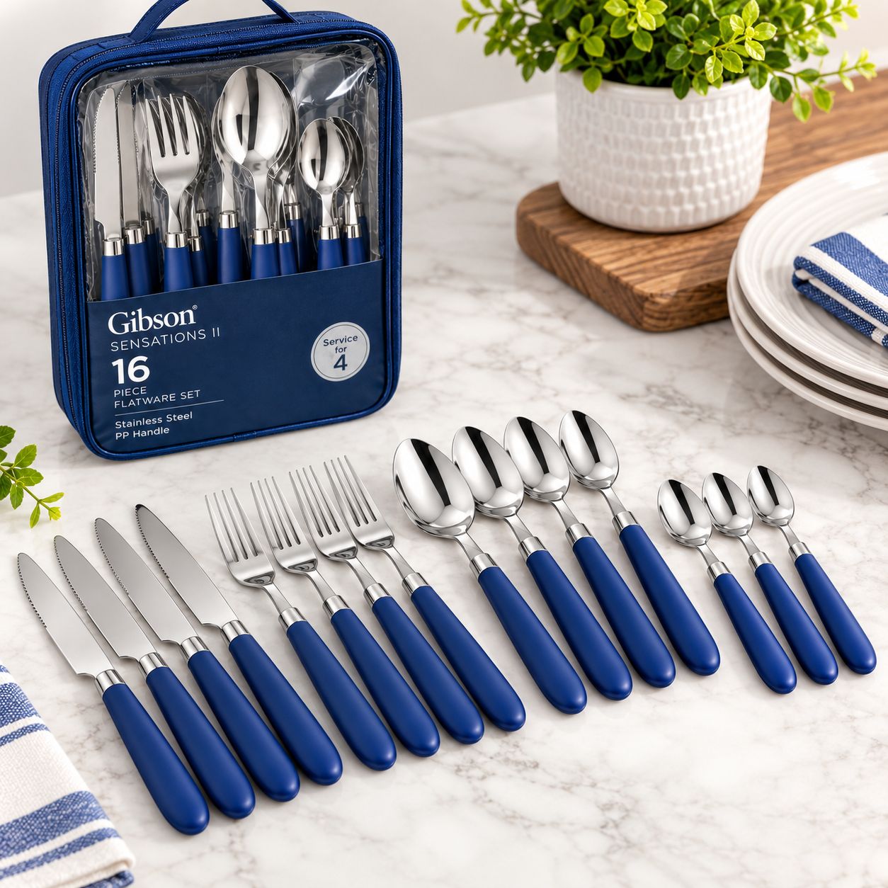 GIBSON SENSATIONS II 16-PIECE STAINLESS STEEL FLATWARE SET WITH COBALT POLYPROPYLENE HANDLES &amp; WIRE CADDY – MODEL 53528.16 – UPC 085081765000