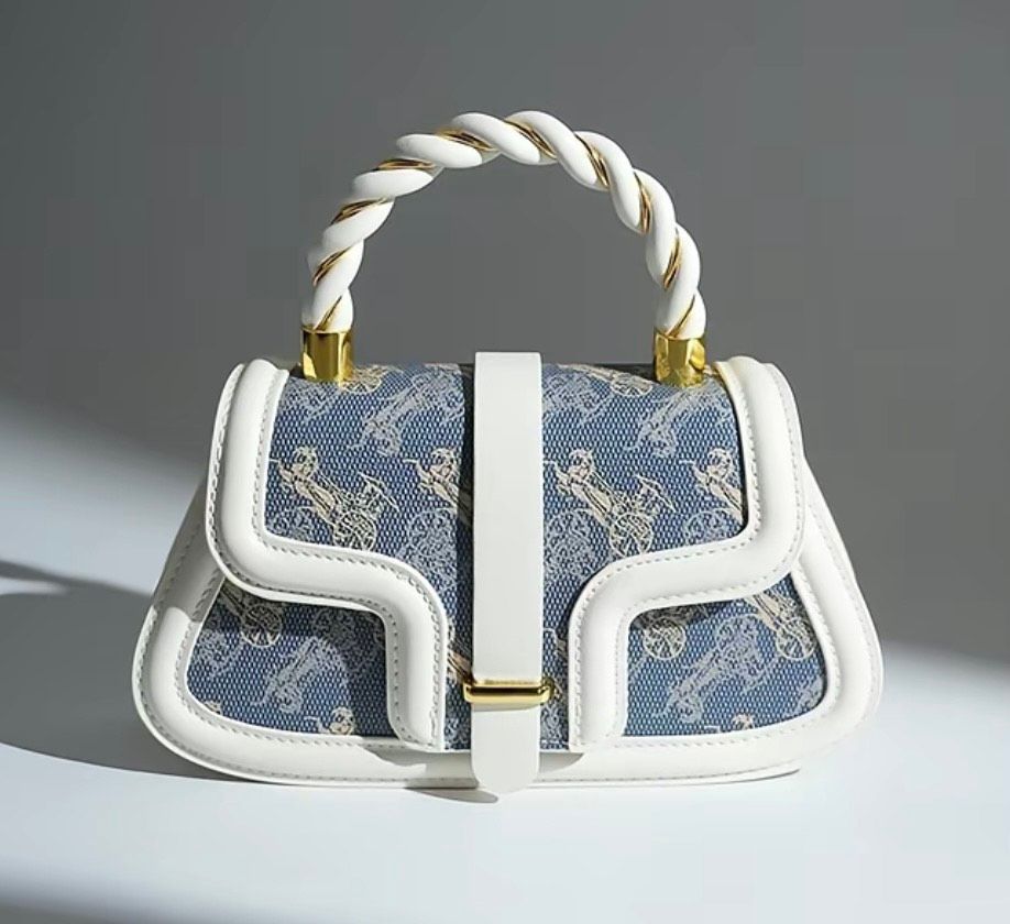 Ivory Saddle Bag with Unique Design &amp; Gold Accents in PU Leather Featuring Blue Pattern and White Trim
