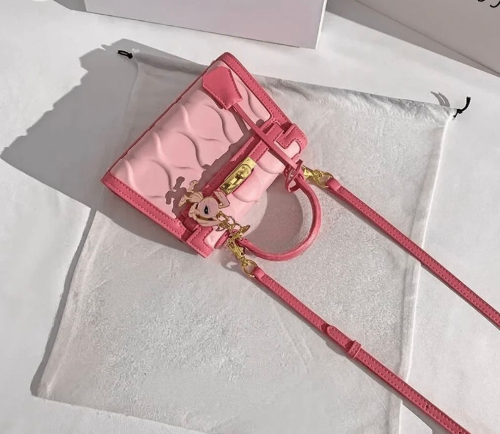 The Pink Muse- Pink Handbag with Unique Design and Gold Lock Detailing