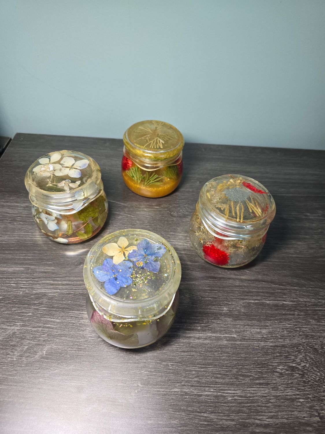Handmade resin jar with real dried flowers for keepsake or decorative use