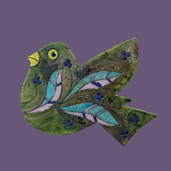 Raku bird on a purple card by Annabel Langrish
