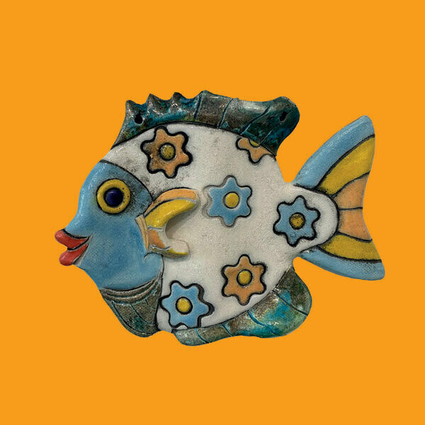 Raku fish on a yellow card by Annabel Langrish