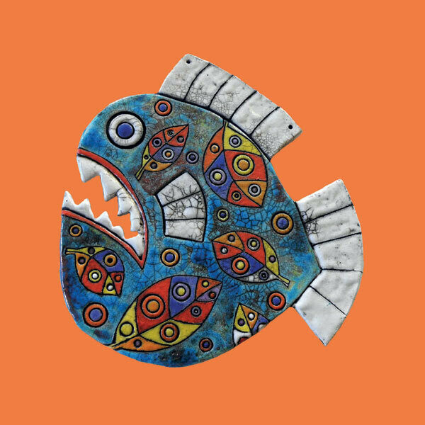Raku fish on an orange card by Annabel Langrish