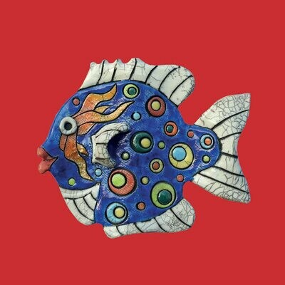 Raku fish on a red card by Annabel Langrish