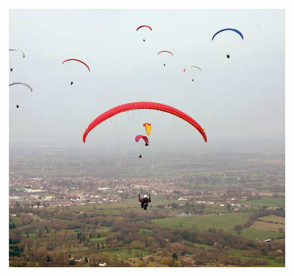 Paragliders above the hills