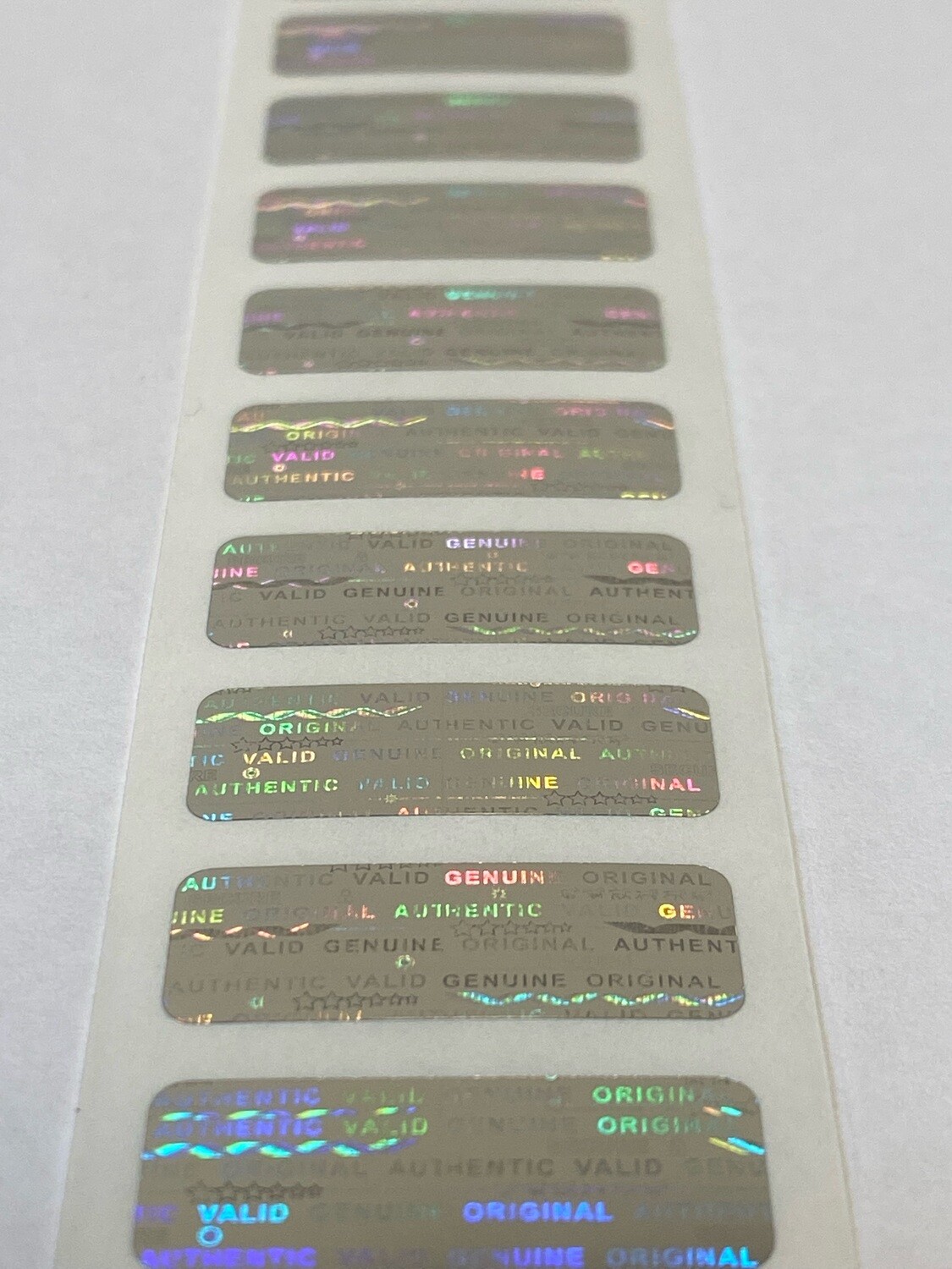 1 X .375 Inch rectangle bright silver tamper evident hologram label