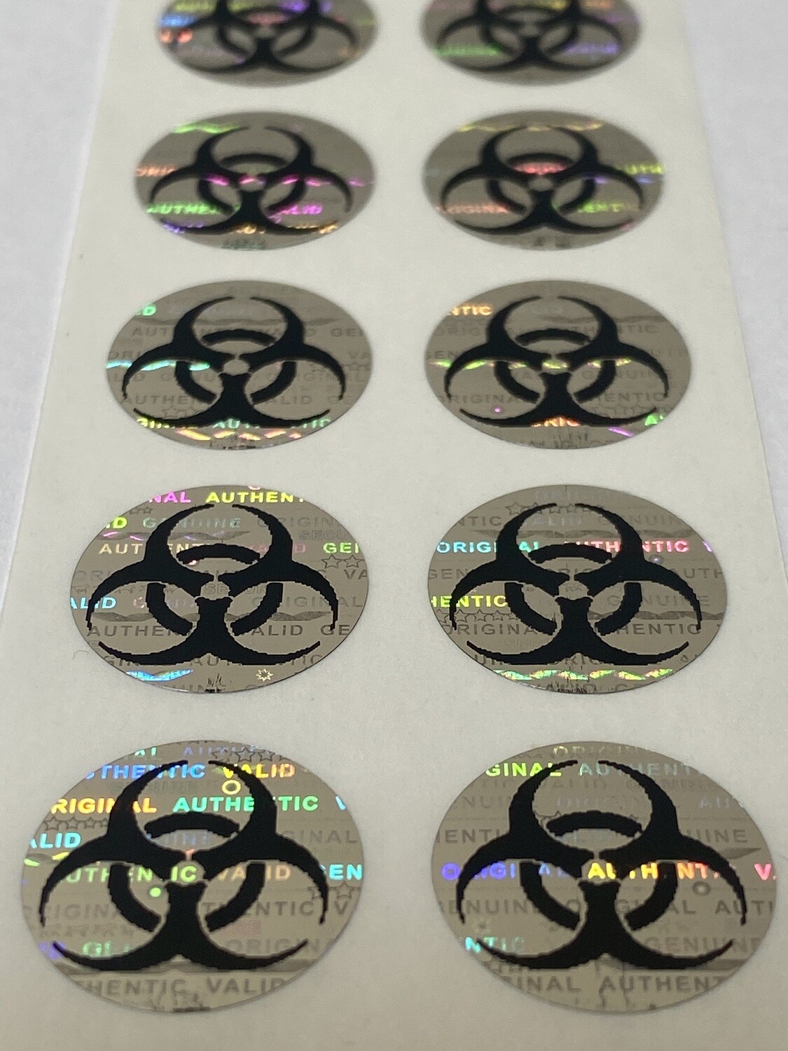 .625 inch round tamper evident hologram label w/ biohazard symbol