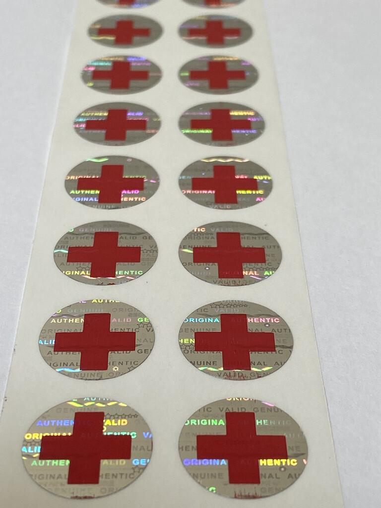 .625 inch round tamper evident hologram label w/ medical symbol