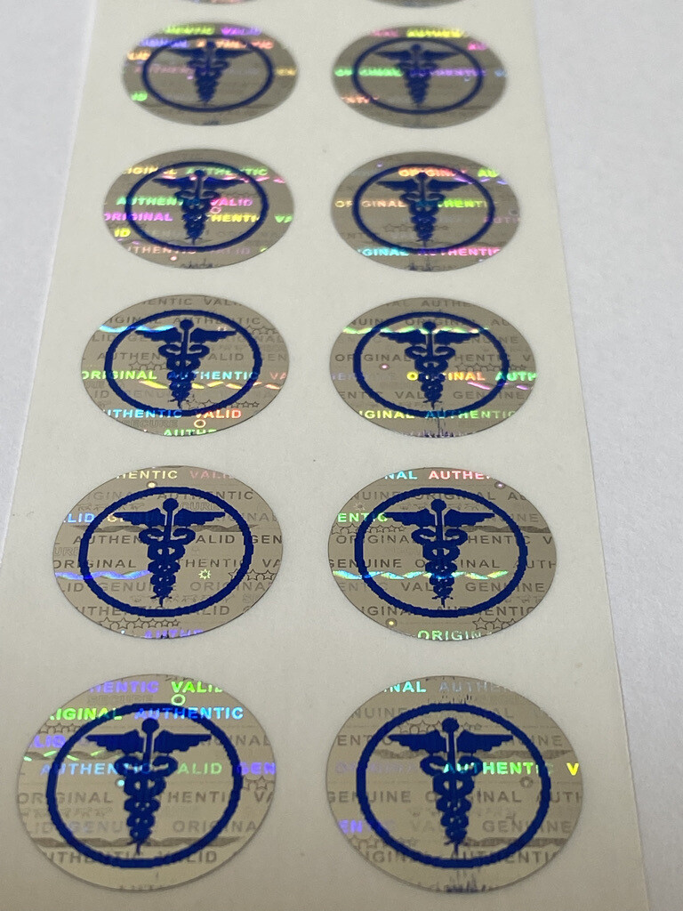 .625 inch round tamper evident hologram label w/ caduceus