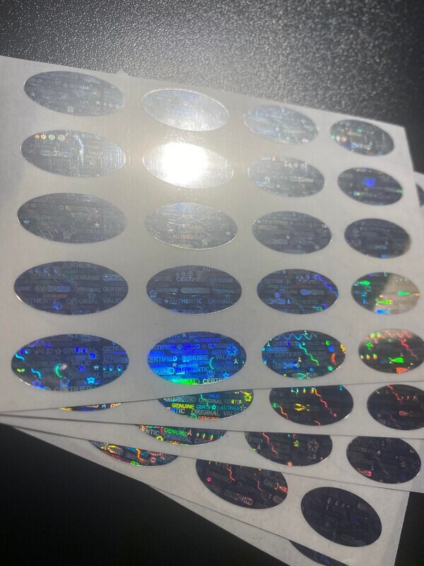 [QTY 100] .75 X .35 Inch Bright Silver Oval Tamper Evident Labels