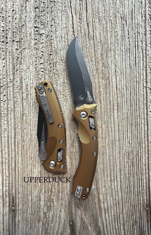 Microtech Amphibian RAM-LOK Manual Folder – Black Standard Edge Blade, Tan Aluminum Handle (137RL-1FLTA)