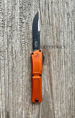 Microtech Combat Troodon GEN III OTF – Black Standard Edge Blade, Orange Aluminum Handle (1143-1OR)