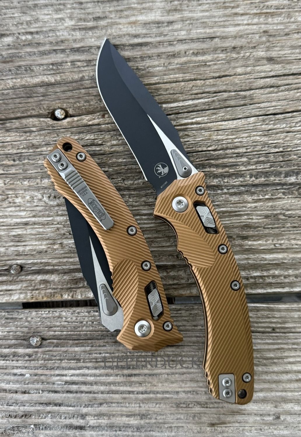 Microtech Amphibian RAM-LOK Manual Folder – Black Standard Edge Blade, Tan Aluminum Handle (137RL-1FLTA)