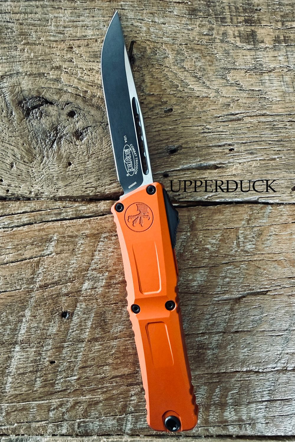 Microtech Combat Troodon GEN III OTF – Black Standard Edge Blade, Orange Aluminum Handle (1143-1OR)