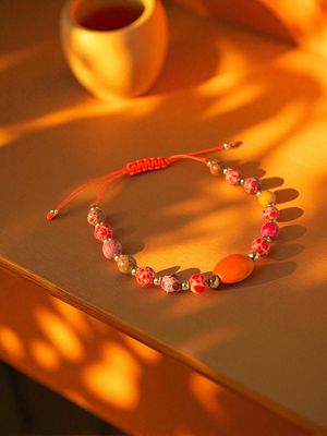 ​Bransoletka z pomarańczowymi jaspisami i howlitem