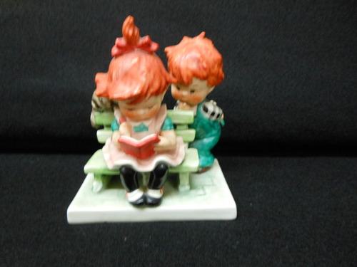 Hummel Red Heads Sitting On A Bench