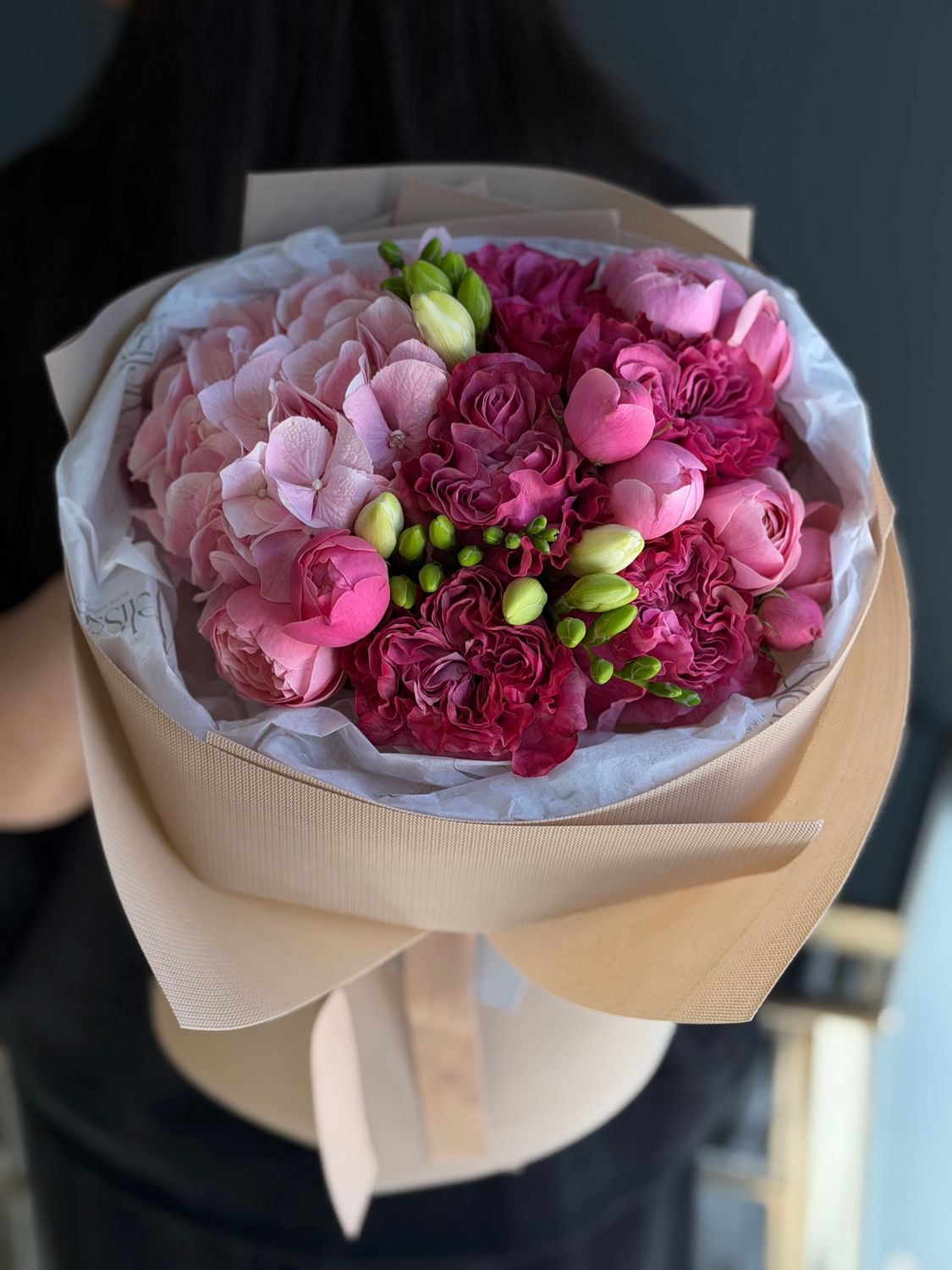 Bouquet with raspberry roses, spray roses, freesias, and hydrangeas «Mireya»