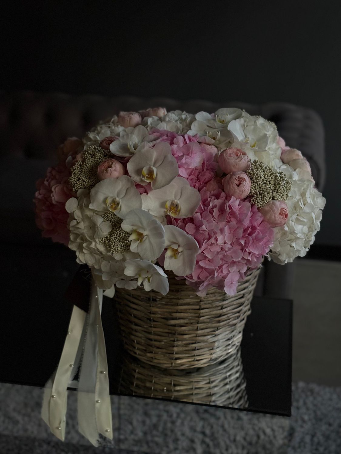 Basket with hydrangea, spray rose, orchids and ozothamnus «Olga»