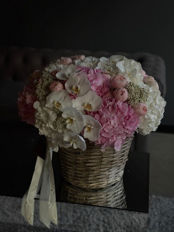 Basket with hydrangea, spray rose, orchids and ozothamnus «Olga»